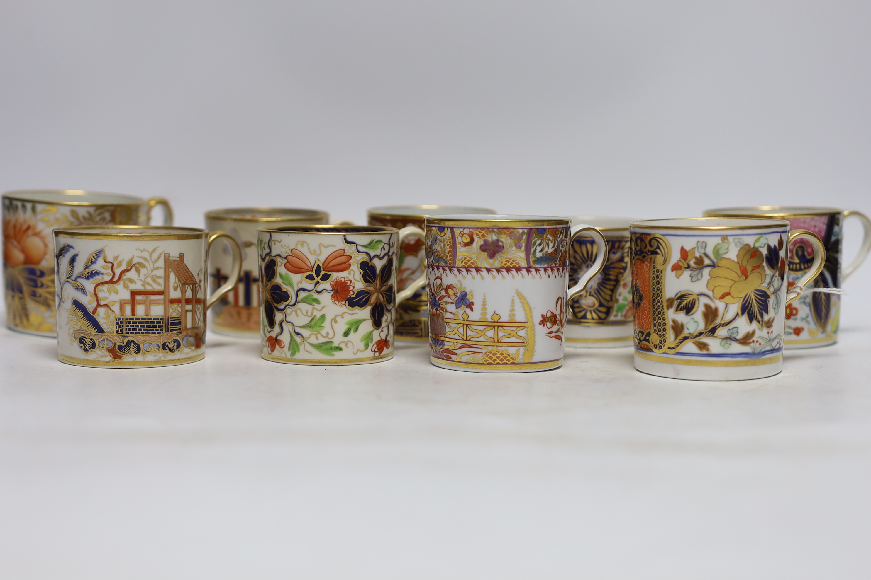 Twelve 1800-1820 English porcelain coffee cans, including Imari pattern examples